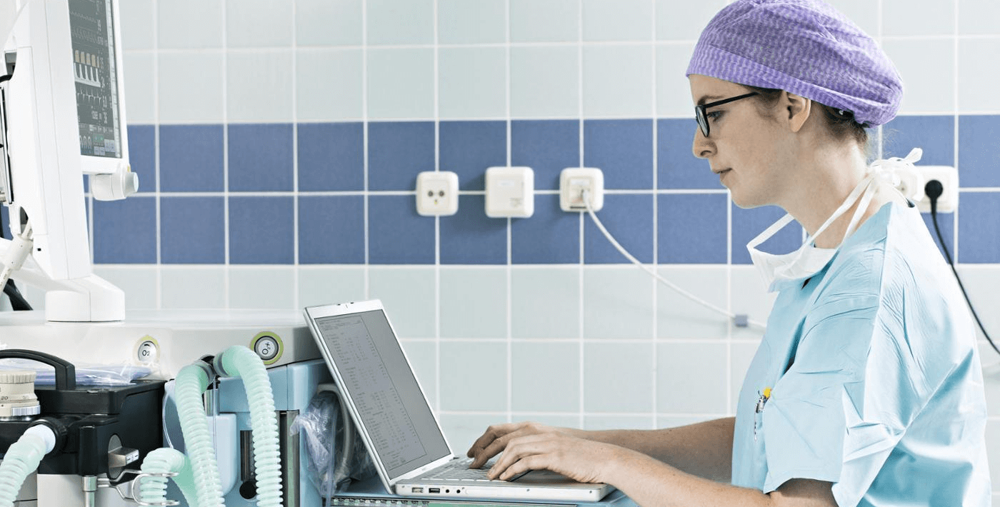 A nurse working on her computer